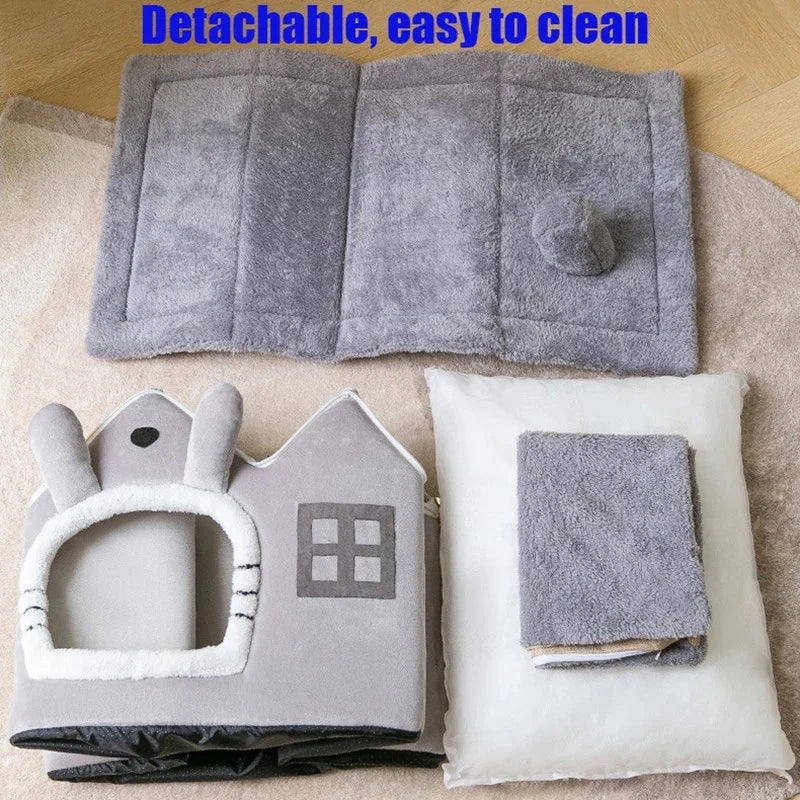 Gray pet bed with detachable cover and cleaning instructions on a wooden floor.